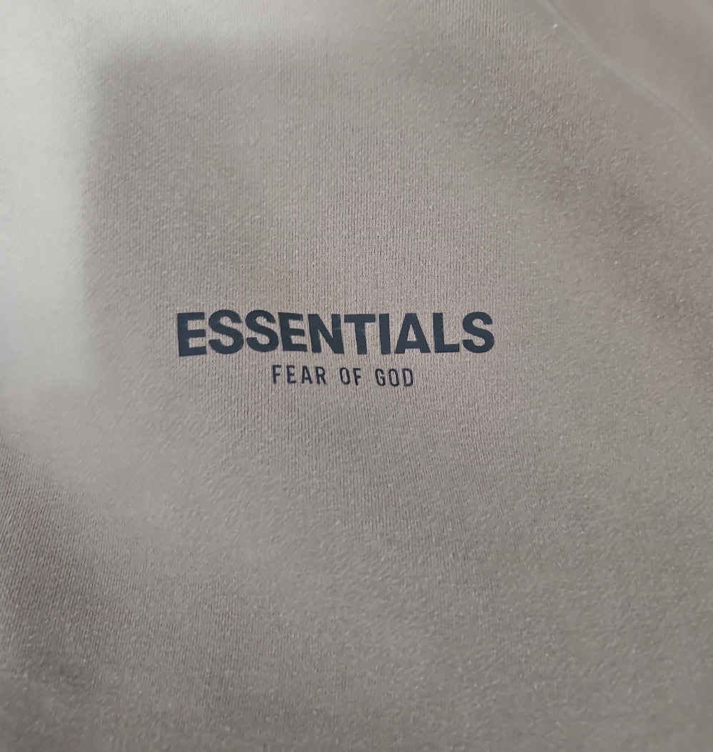 Fear of God ESSENTIALS Heavy Hoodie in Off-White with Black Logo